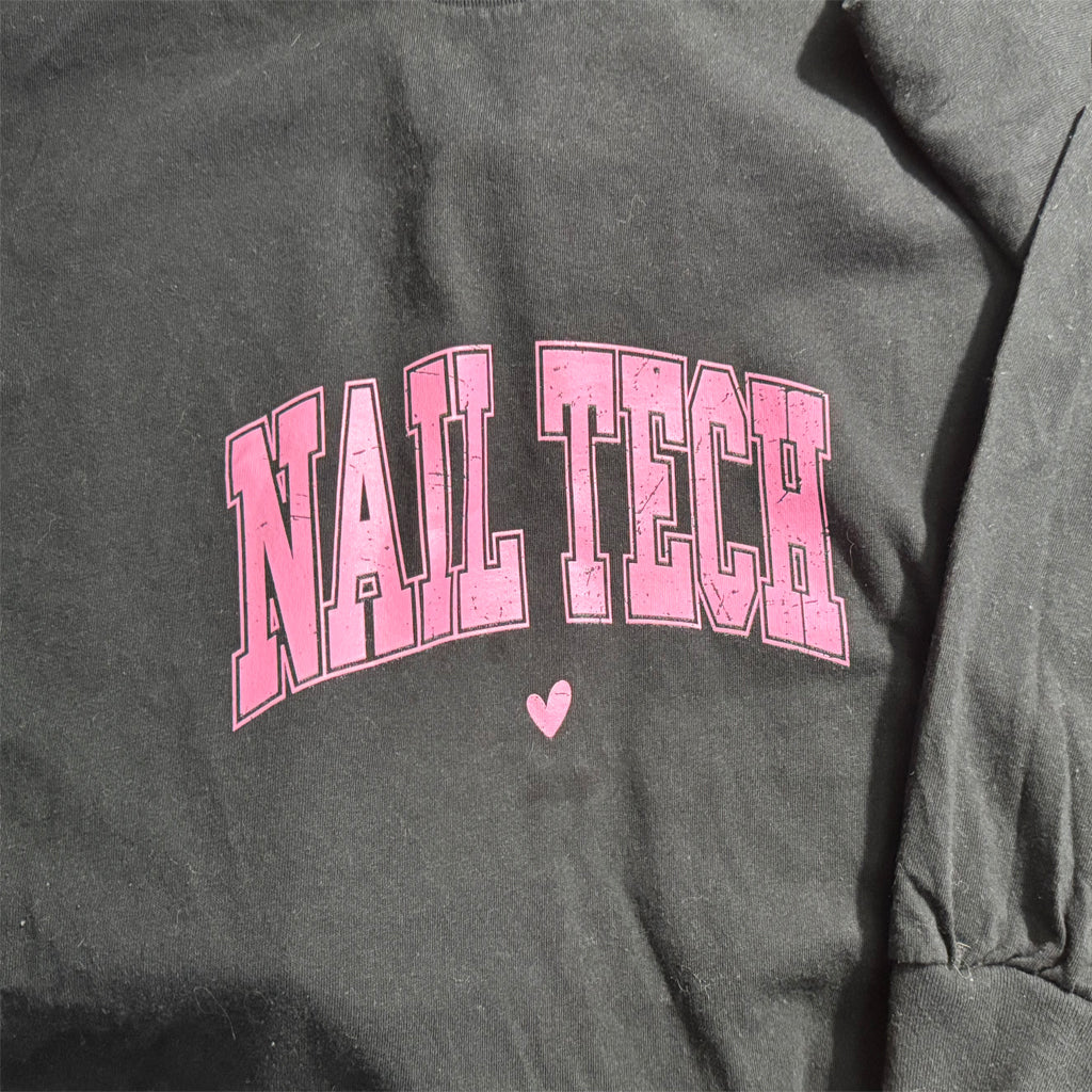 Gray sweatshirt with 'NAIL TECH' in pink text and a heart symbol.