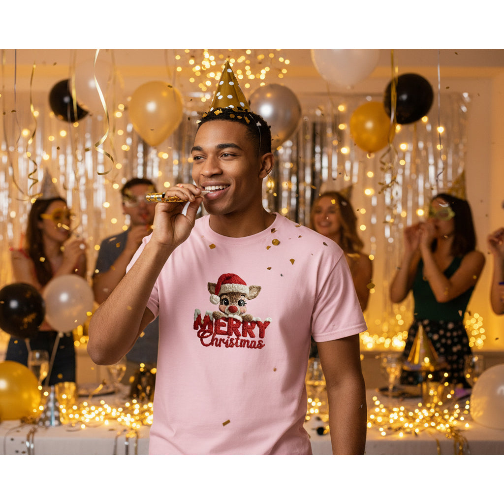 Man wearing a pink 'Merry Christmas' t-shirt at a festive party with balloons and decorations.