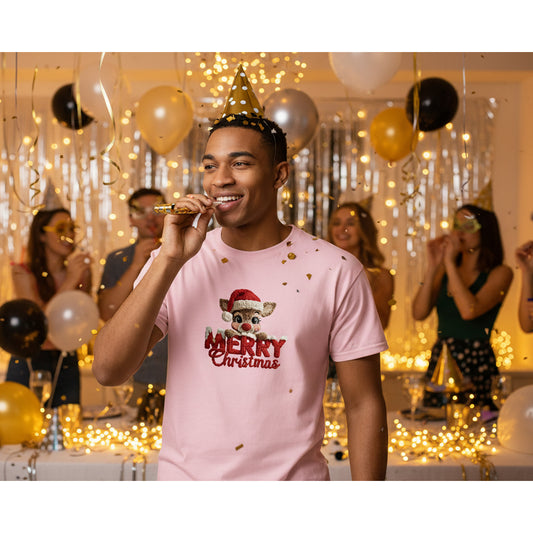 Man wearing a pink 'Merry Christmas' t-shirt at a festive party with balloons and decorations.
